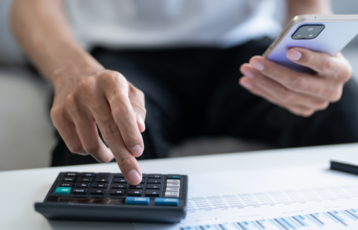 A man using a calculator
