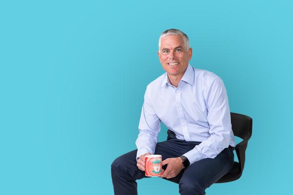 Allan Wilson, Managing Director of Wilson Partners sat on a chair