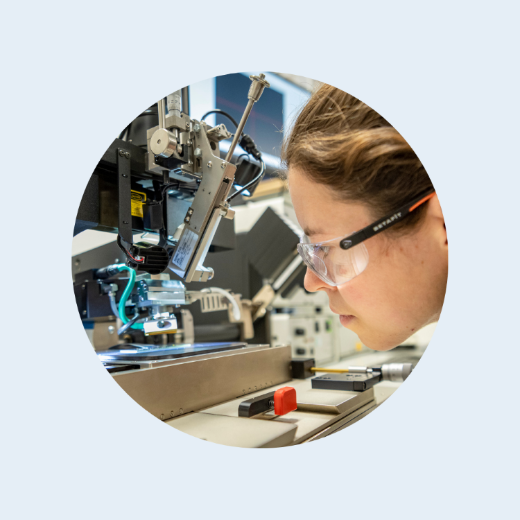 female scientist looking at neurotech 