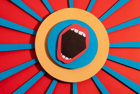 An open mouth illustration in a blue circle, a yellow circle is around the blue circle and is surrounded by blue stripes on a red background