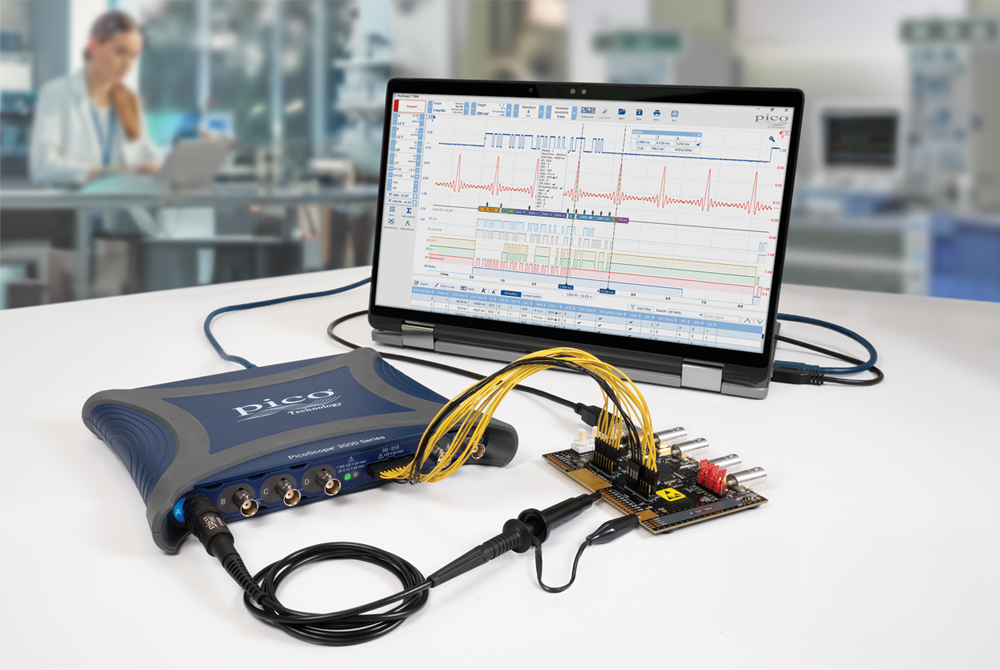 PicoScope 3418E MSO oscilloscope connected to a demo board and a PC-laptop 