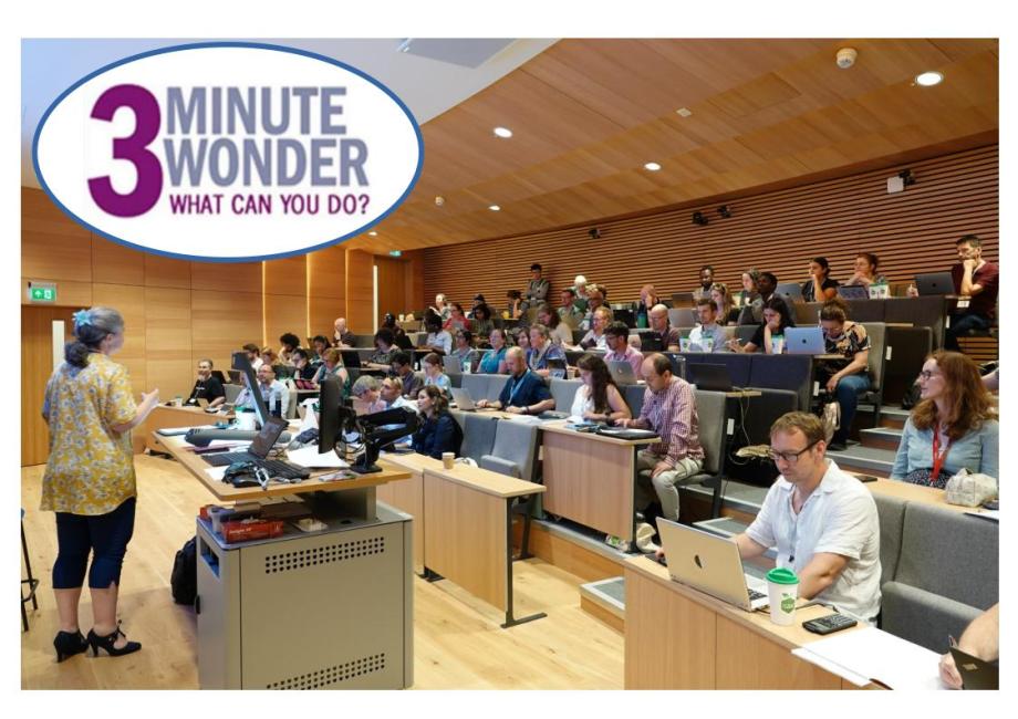 Large meeting room with speaker and public  