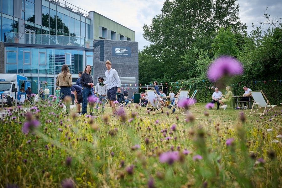 Allia tenants mingling on the lawn of Cambridge Campus business centre