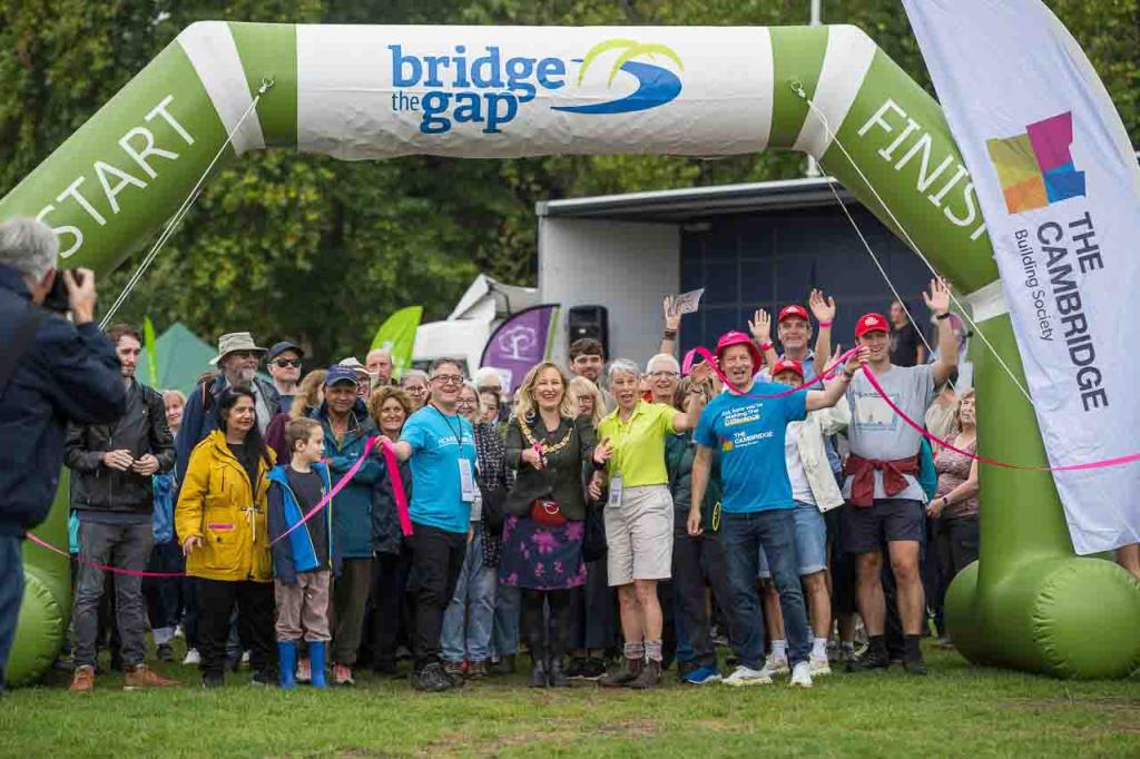 A large group of people at the start line of Bridge the Gap