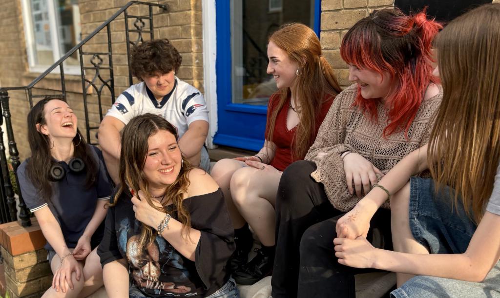 Young people laughing on steps