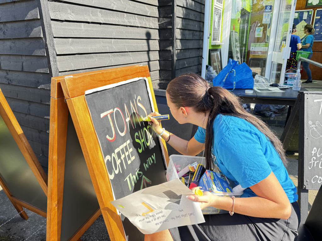 Volunteer creating a sign