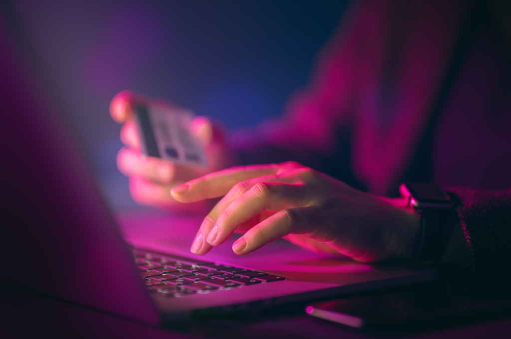 A person typing on a computer to signify potential threat