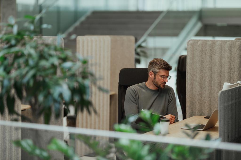Man sat at office desk