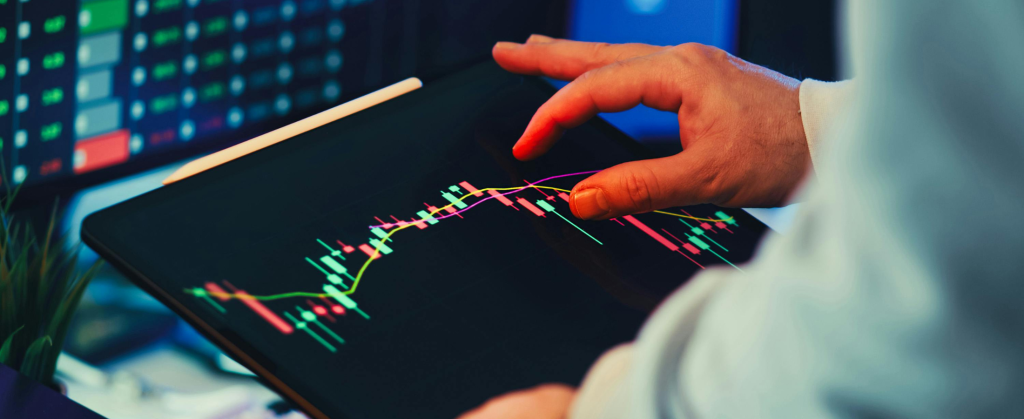 a man looking at investment markets
