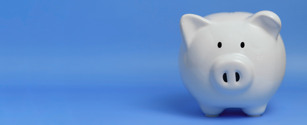 A white piggy bank against a blue background