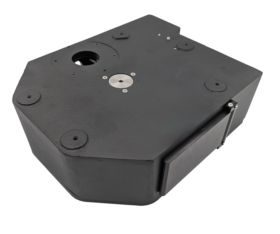 A black box-shaped device for switching filter cubes used in fluorescence microscopy. 