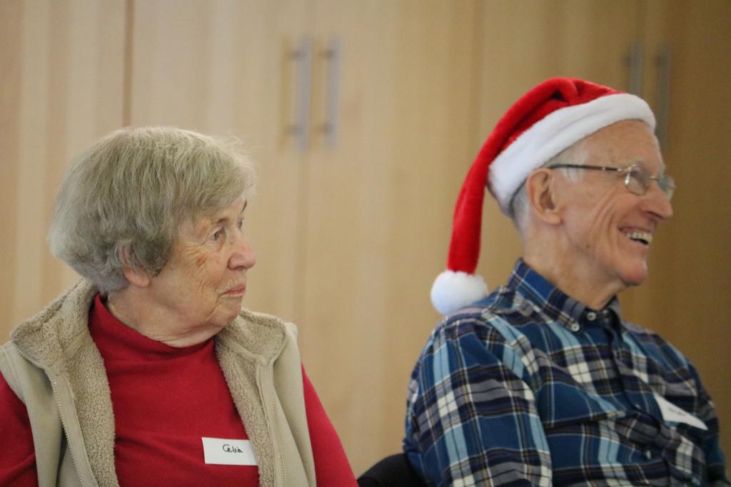 Two carers enjoy a Christmas party