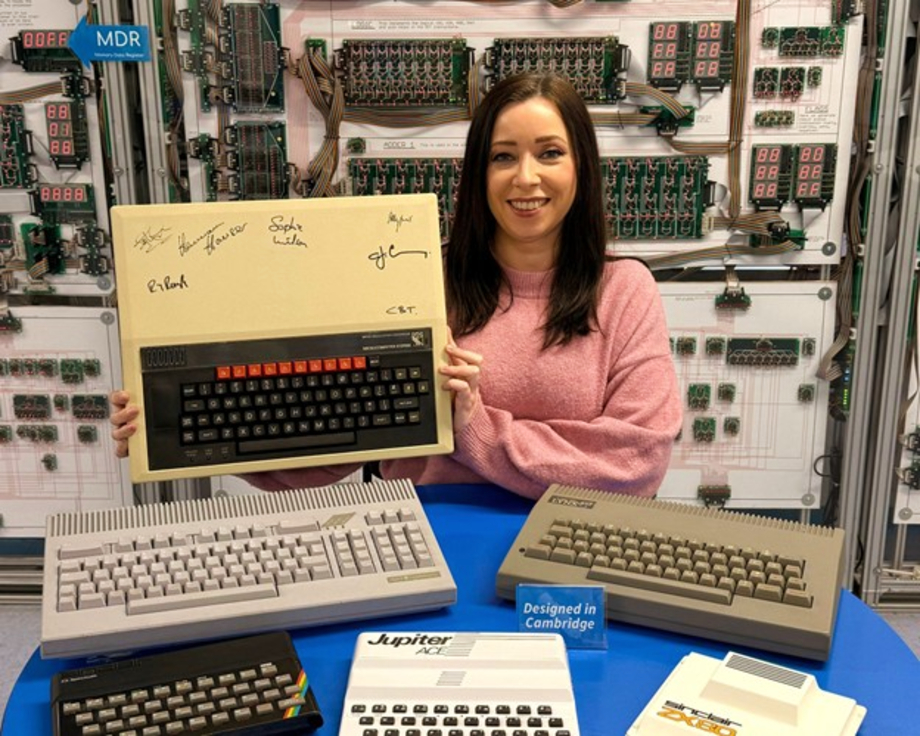 Centre for Computing History Archivist Kate Stockwell displays a signed Acorn Computers BBC Micro and other computing hardware developed in Cambridge. 