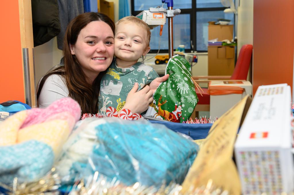 One of the children with the present they picked for their mum