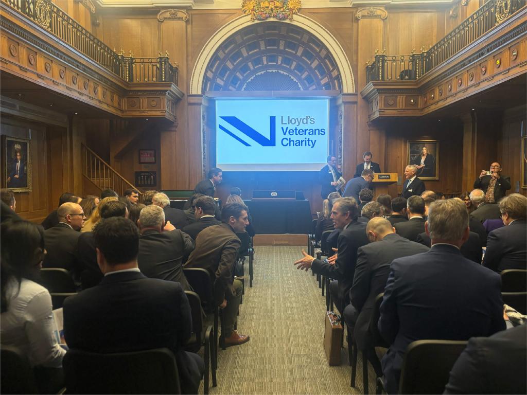 Lloyd's Veretans Charity logo on-screen at launch event