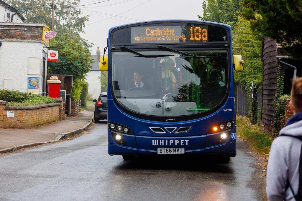 A bus pulling in to pick someone up