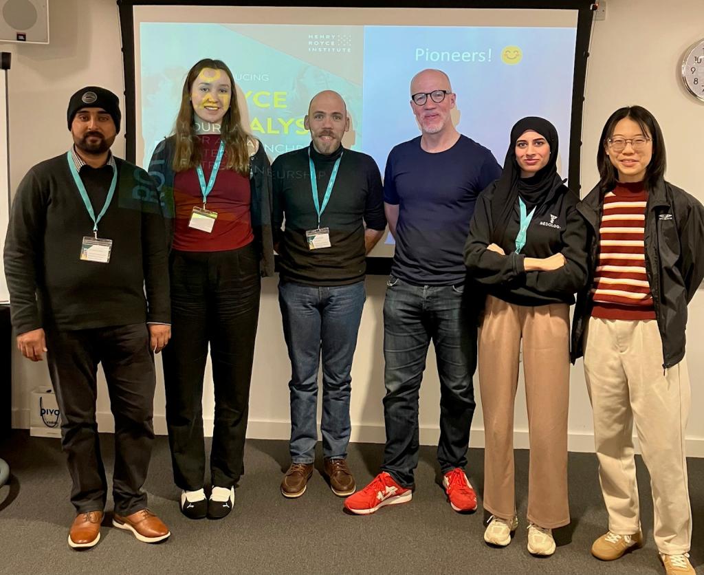 Simon with a group of students in a lecture