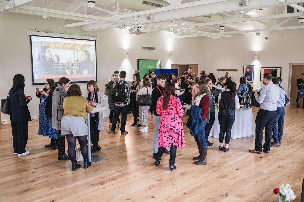 A diverse group of professional people networking at Jesus College Cambridge