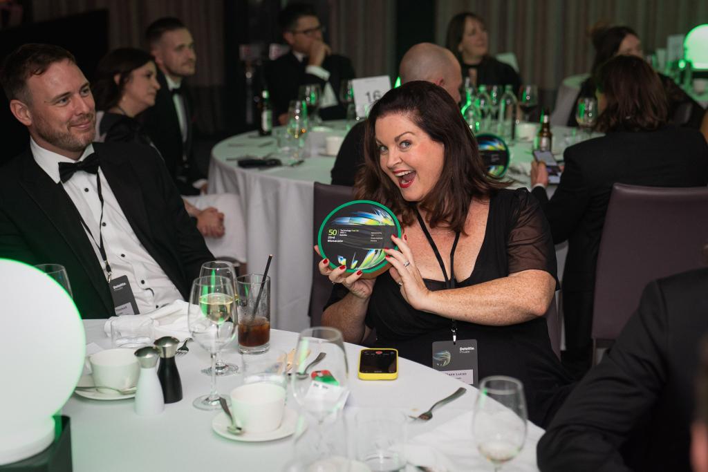Monavate employee with award