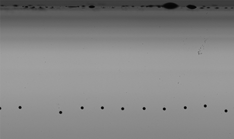 Image shows ink droplets - part of Meteor's Inkjet Nozzle Health Technology