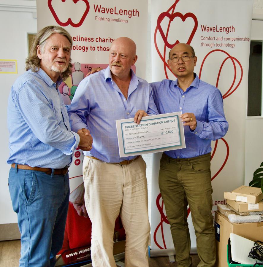 Paul (left), Tim and Freddie (right), with a cheque for The NextPath Device Consortium. 