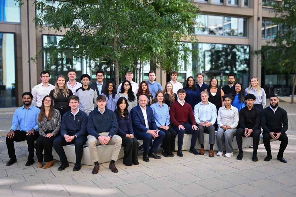 Office Senior Partner, Julian Rae, with Deloitte new joiners.