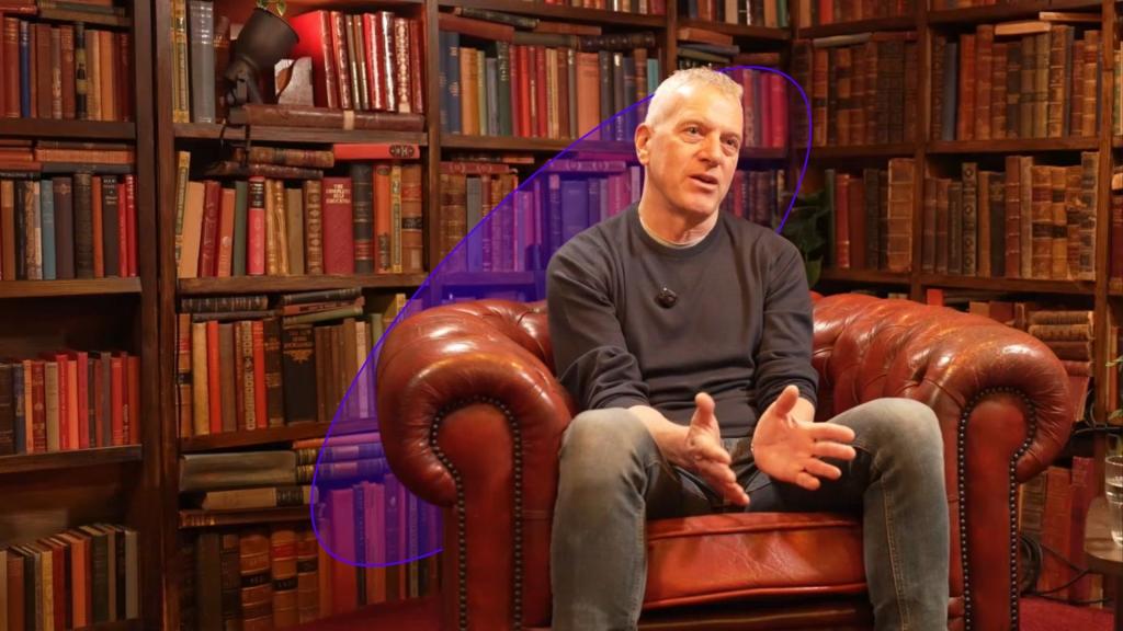 Stan Boland sits for an interview with Amadeus Capital Partners in a library. 