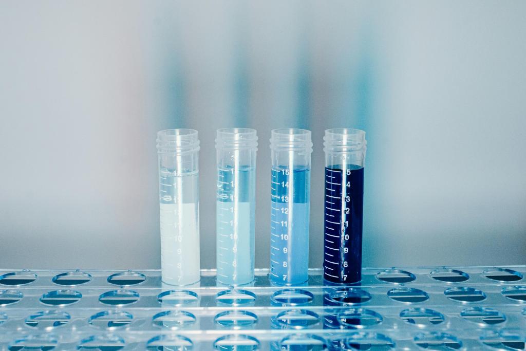 Four test tubes containing liquids, each of a different shade of blue. 