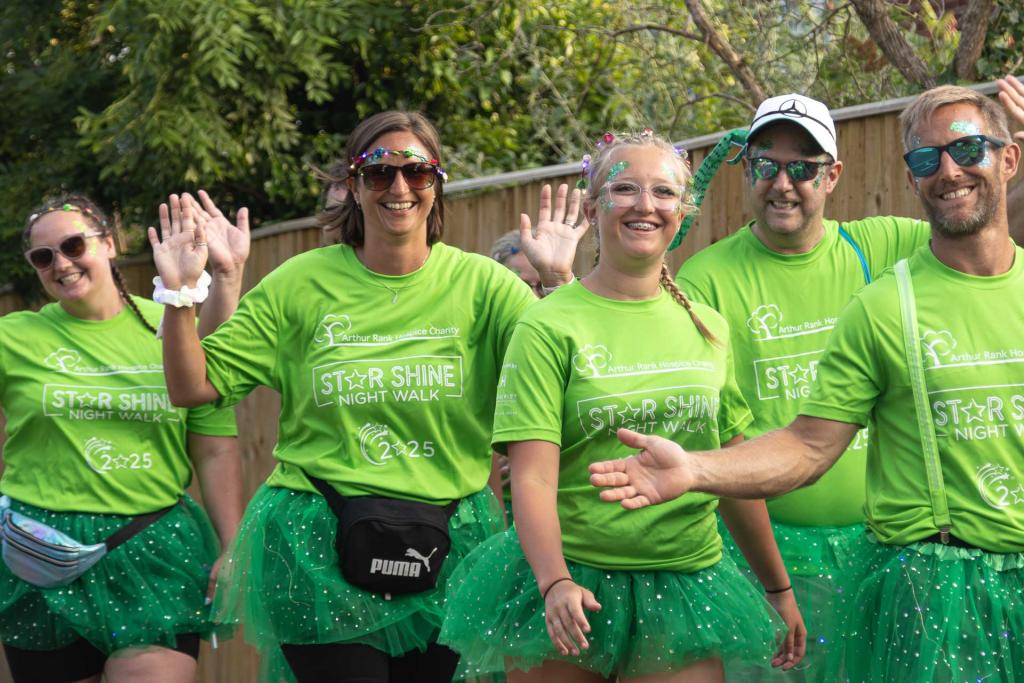 Male and females walkers dressed in green