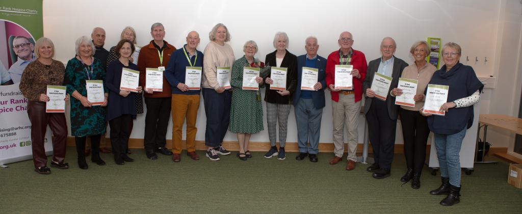 A group of adults holding certificates 