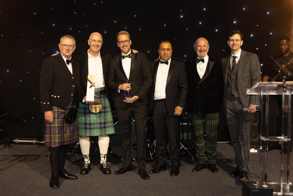 Chris Welch receiving an award