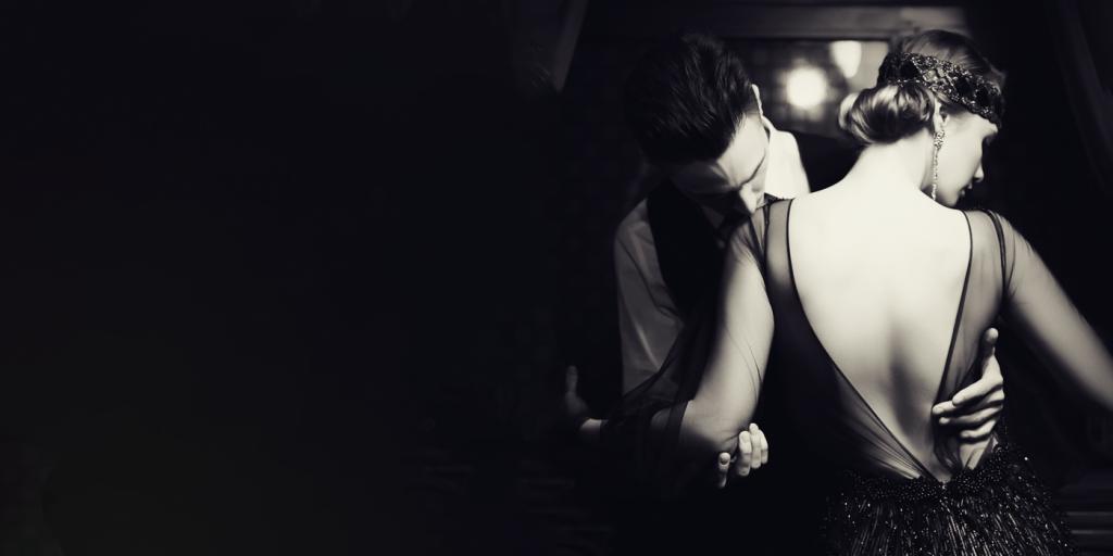 A man and woman embrace.
