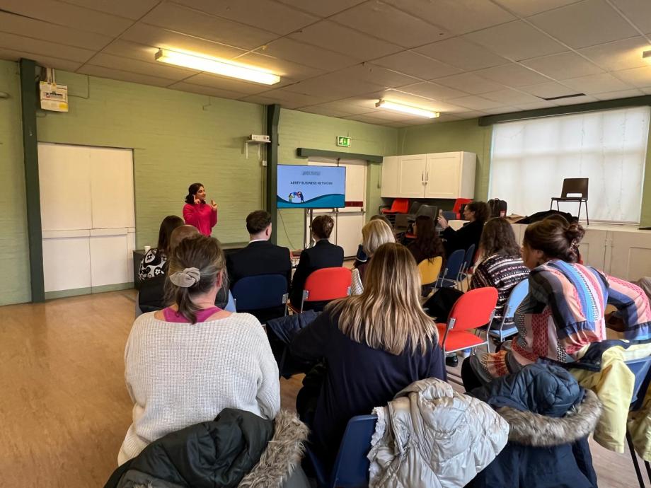 Networking presentation with a speaker and seated audience