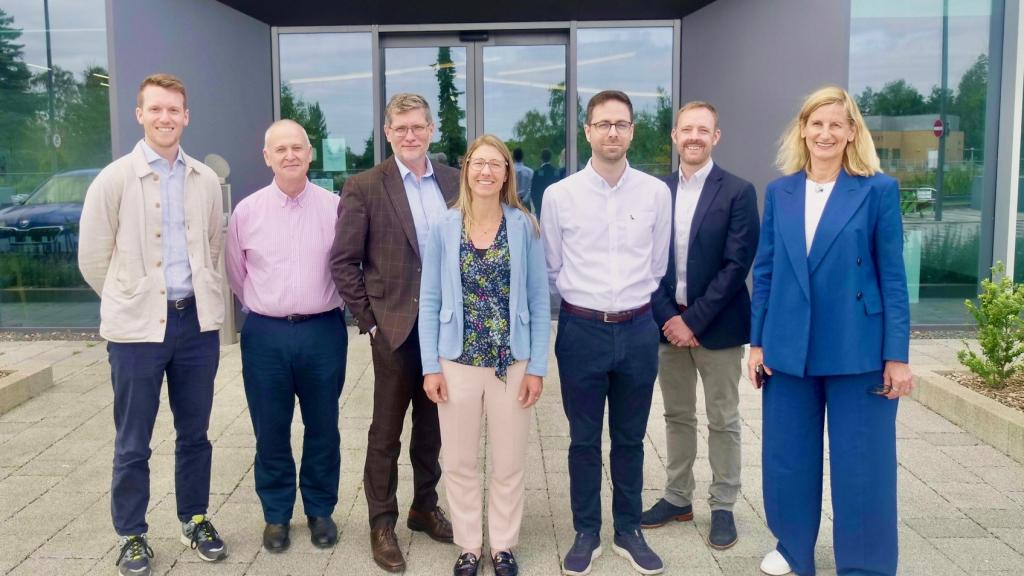 Xampla investors and founders posing for a photograph outside the Cambridge headquarters.
