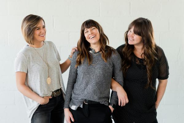 3 women smiling and laughing