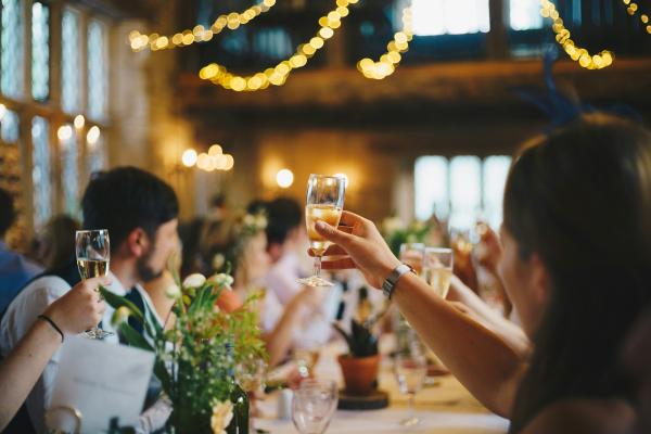 People doing a cheers at a party