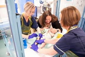 nurses caring for a baby 