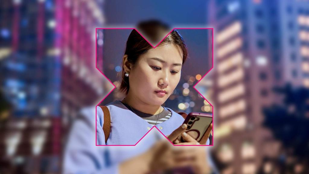 A woman looks intently at her smartphone while standing in a city at night. The scene is overlaid with a bold pink-outlined “X” shape, sharply focused on the woman while the surrounding city lights and buildings are blurred — suggesting focus on digital connection or social media in an urban context.