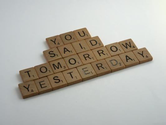 scrabble tiles saying you said tomorrow yesterday