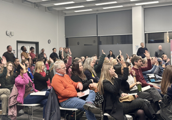 people sitting in a hall