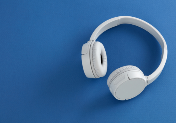 White headphones on blue background 