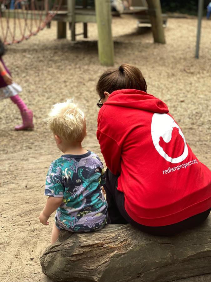 Adult woman sat with little boy