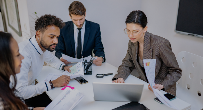 Financial adviser discussing risk tolerance questionnaire with client