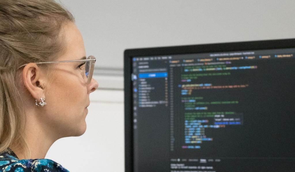 Women coding at desk
