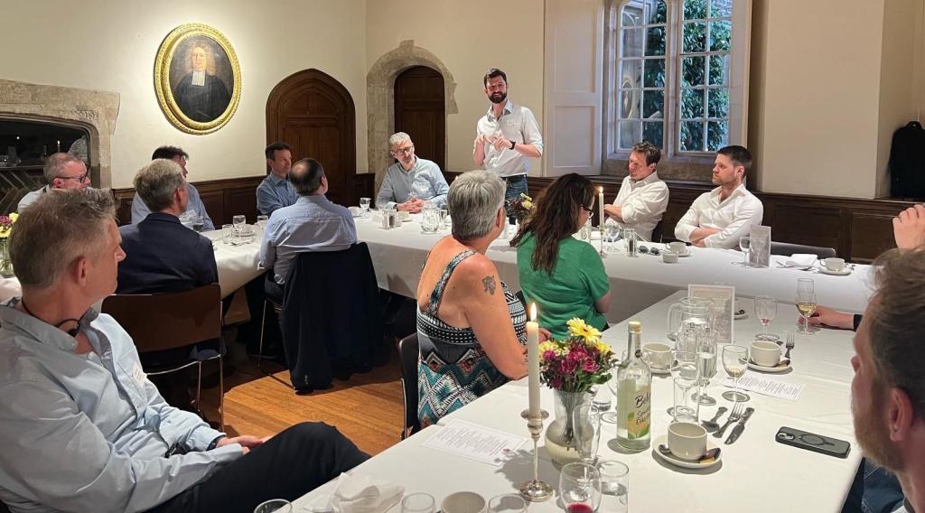 Man giving speech to a room of business people
