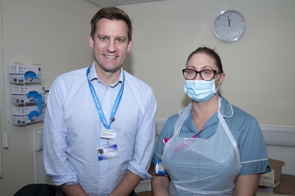 The Chief Executive of the University Hospitals of Leicester NHS Trust, Richard Mitchell with Leicester Hospital nurse