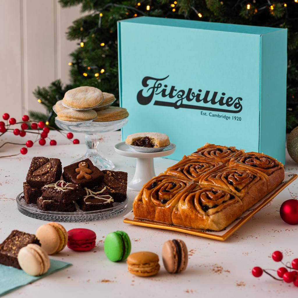 a blue box with cakes displayed in front
