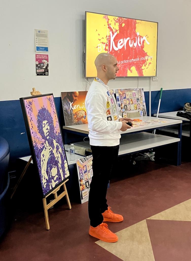 Kerwin Blackburn speaking about his 'By Kerwin' art business experienced to Norwich School students