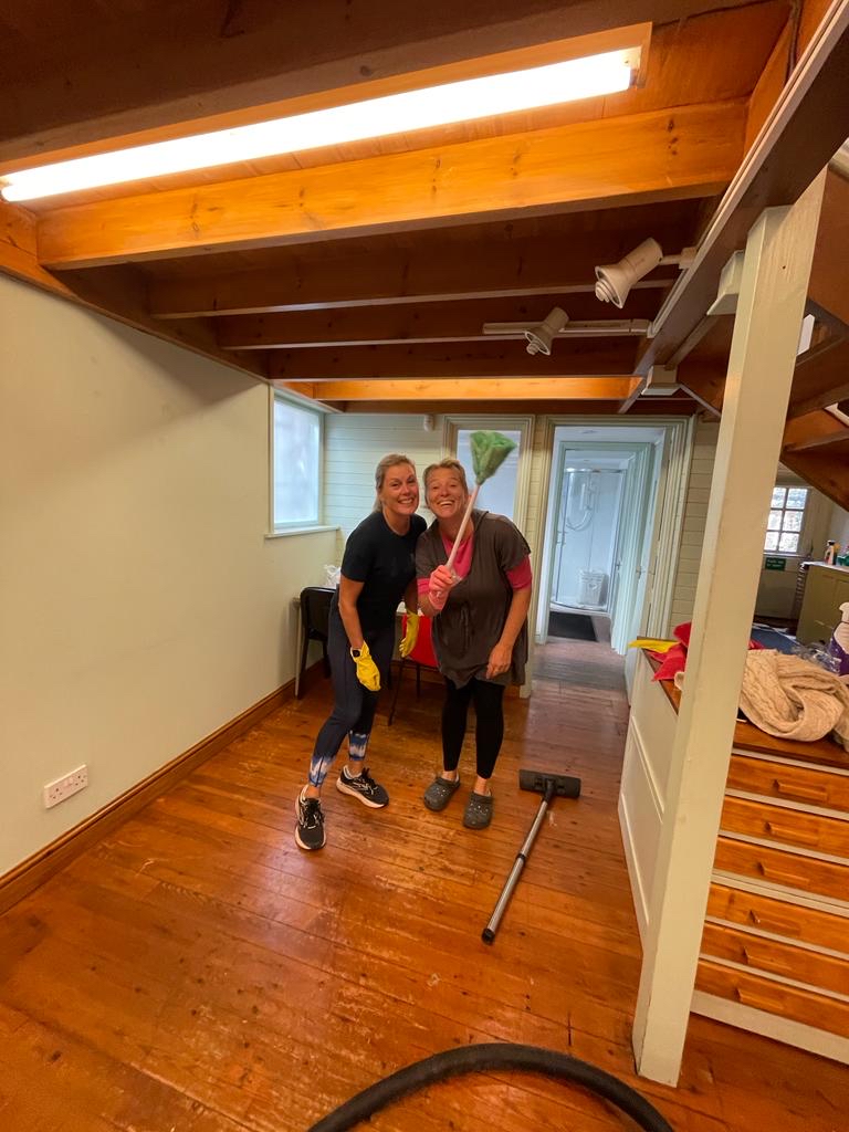 Volunteer Mel and Head of Fundraising Kirsty cleaning the old office