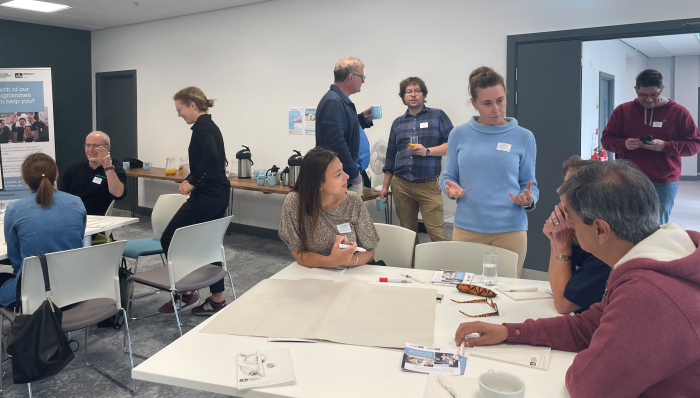 Group of people talking around a table